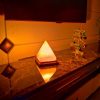 Pyramid Shaped Himalayan Salt Lamp With Wooden Base - Image 2